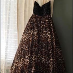 Worn for just a few minutes. Lined with pink tule and has pockets